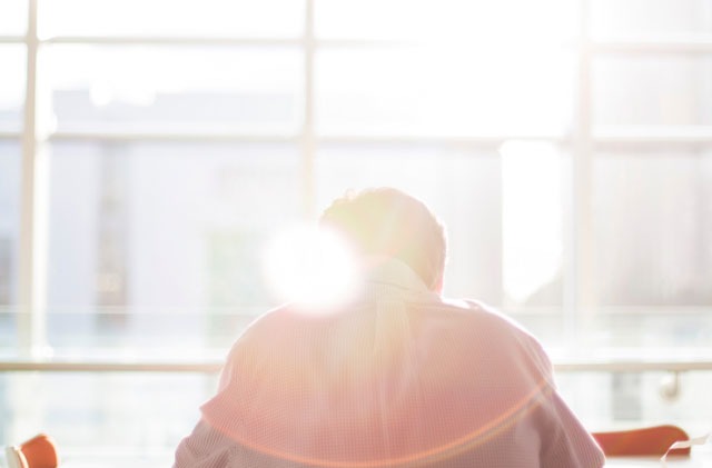 man-sitting-at-table